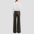 Full-length denim jeans with red zipper closure